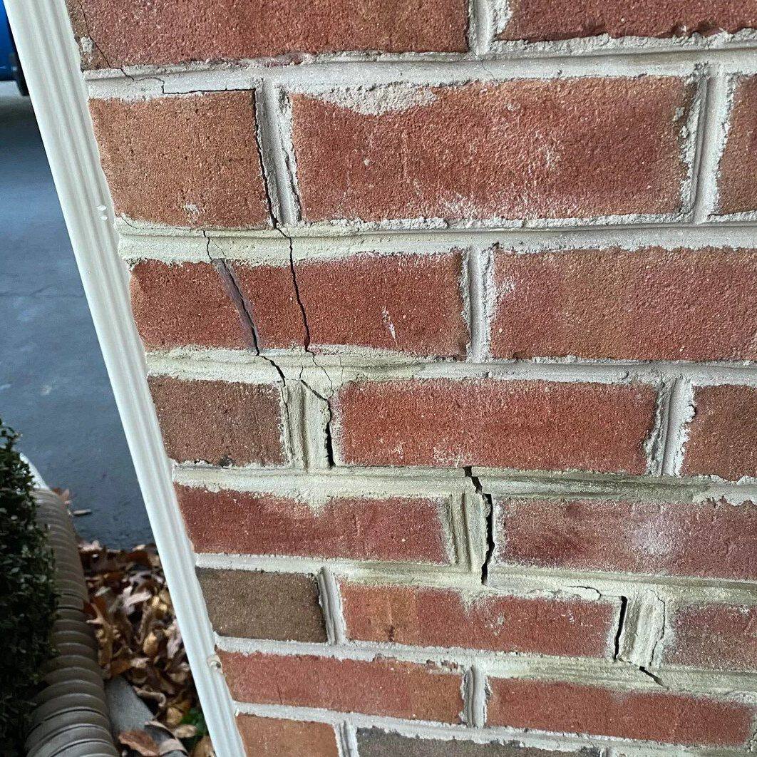 Damaged brickwork before repair